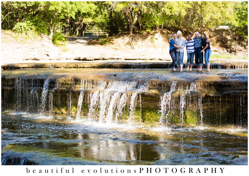 beautiful portrait of family in waterfall