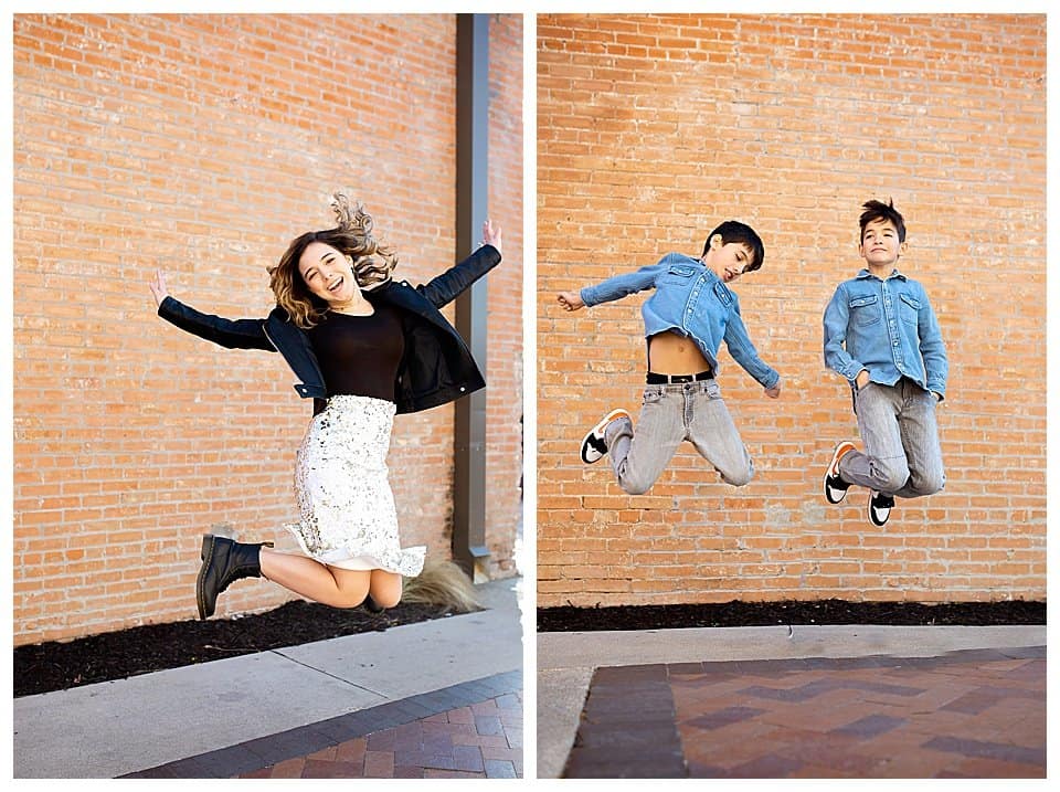 Sister and twin boys jumping