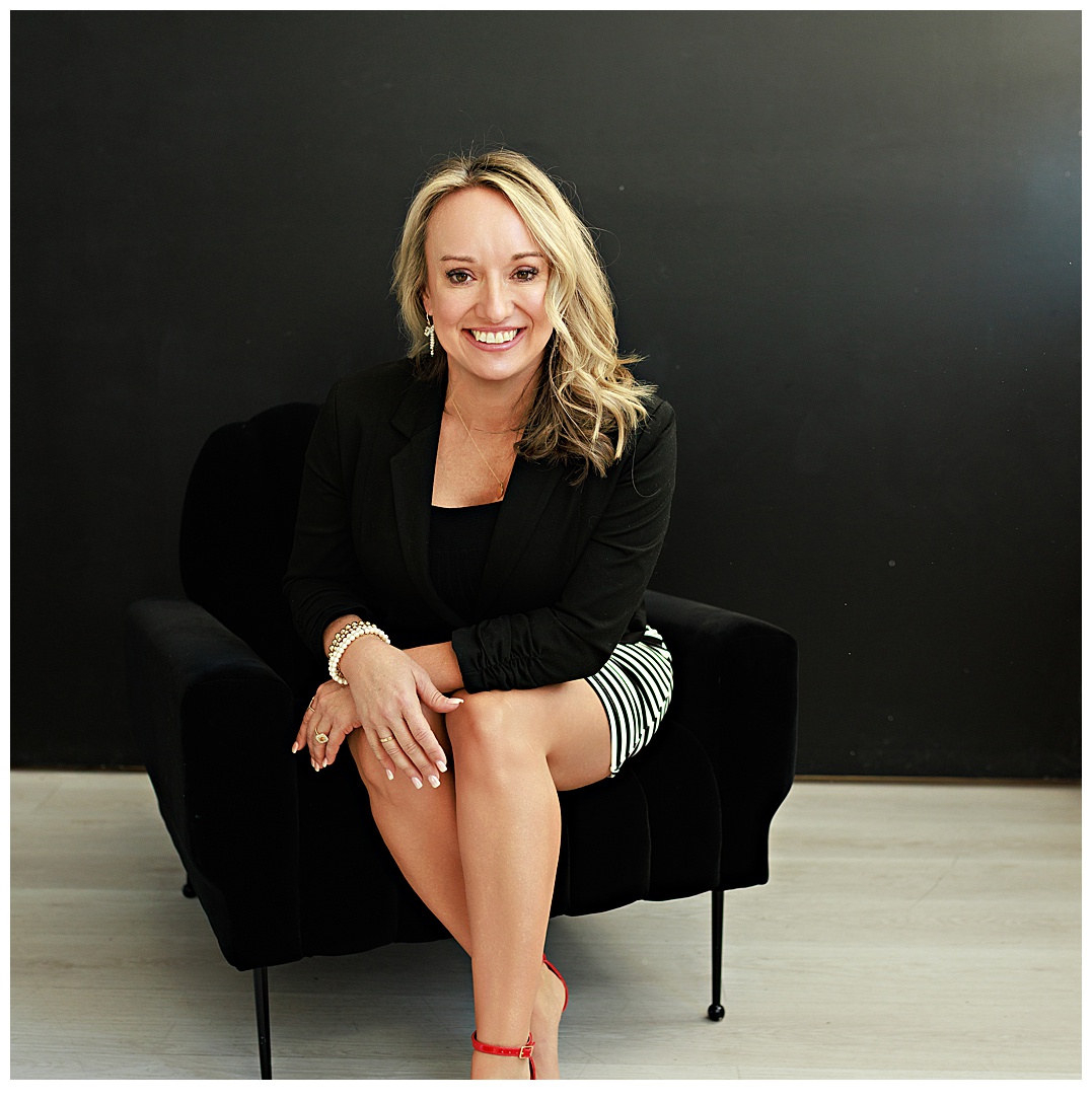 Personal branding photography for women in Fort Worth Texas by a branding photographer, showing a confident blonde business owner seated in a studio chair.