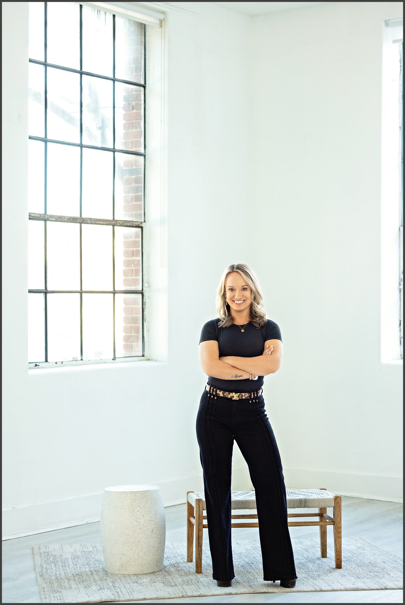 Personal branding photography for women in Fort Worth Texas featuring a confident entrepreneur photographed by a professional branding photographer in a bright studio.